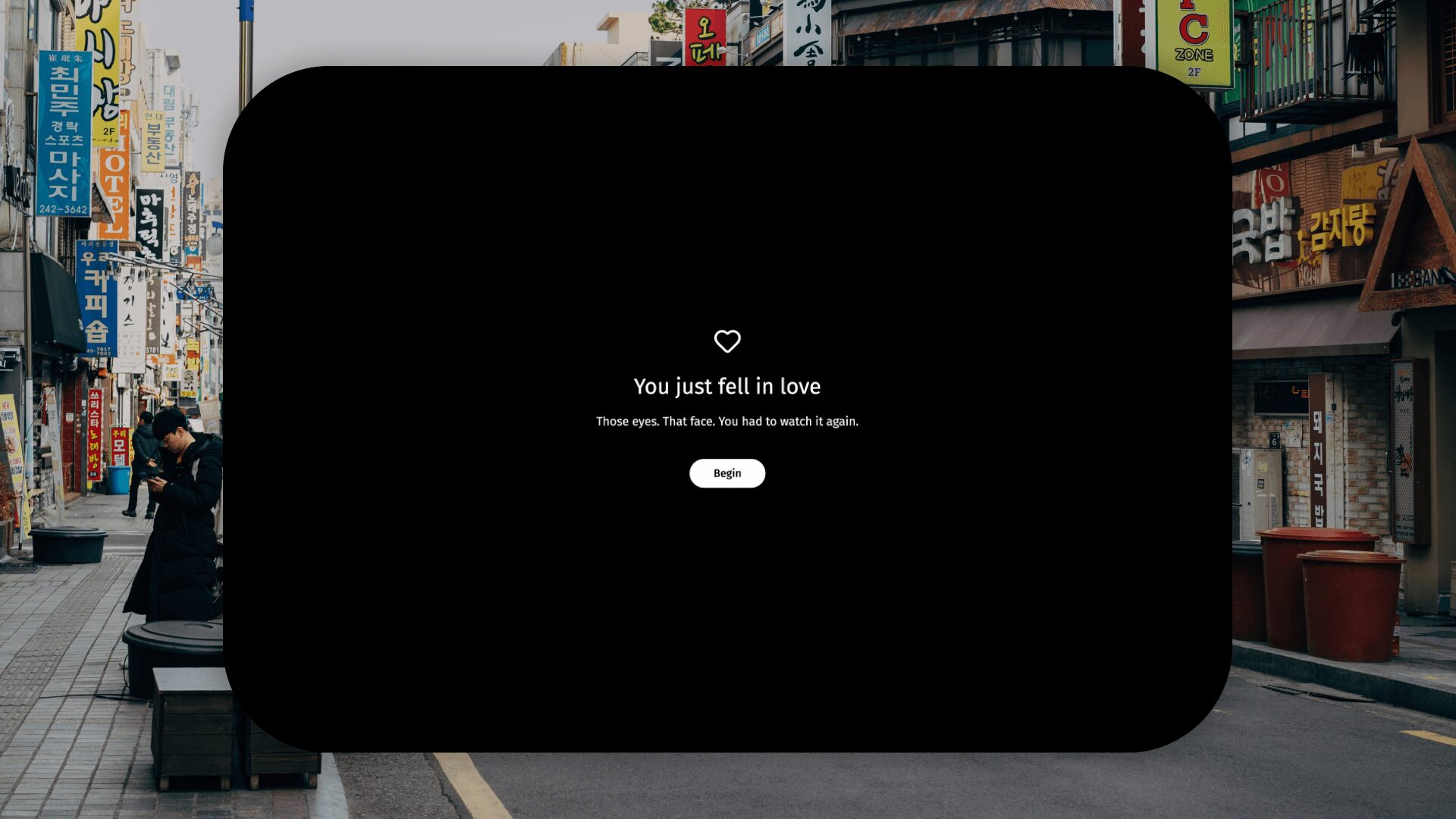 Black screen with white text saying 'You just fell in love' and a button below it.