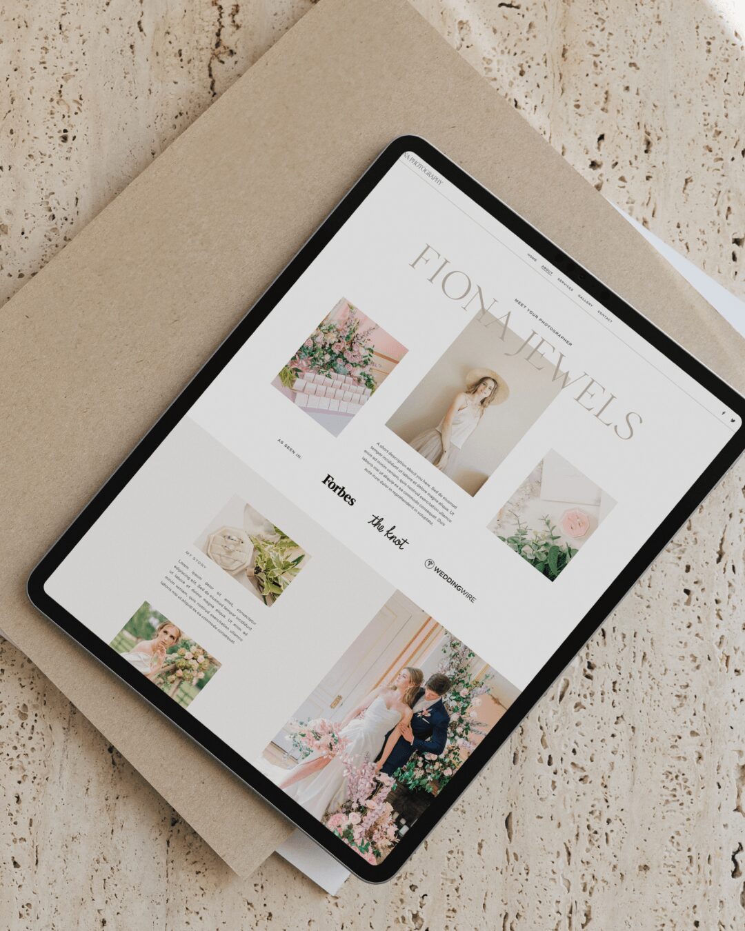 Tablet displaying wedding planning website with images of flowers, bride, and couple in a garden.