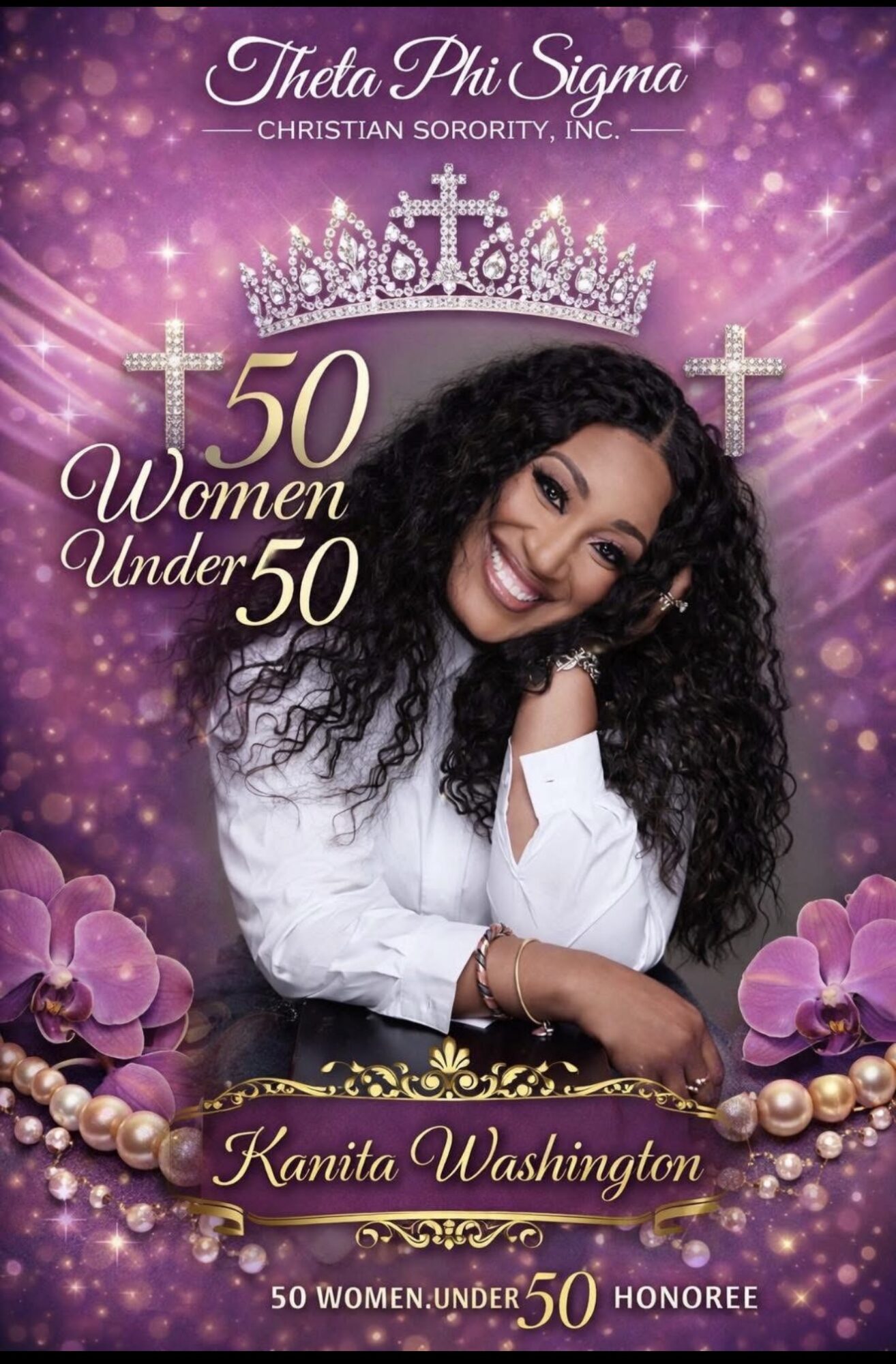 Smiling woman with curly hair wearing a white shirt, crown, and jewelry, surrounded by purple flowers and beads.