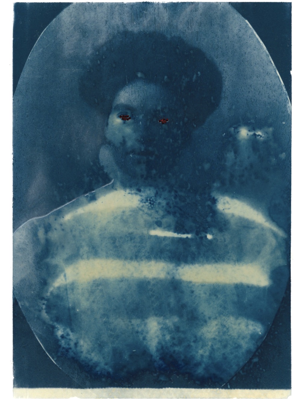 Portrait of a person with short hair, wearing a striped shirt, in a faded, vintage style.