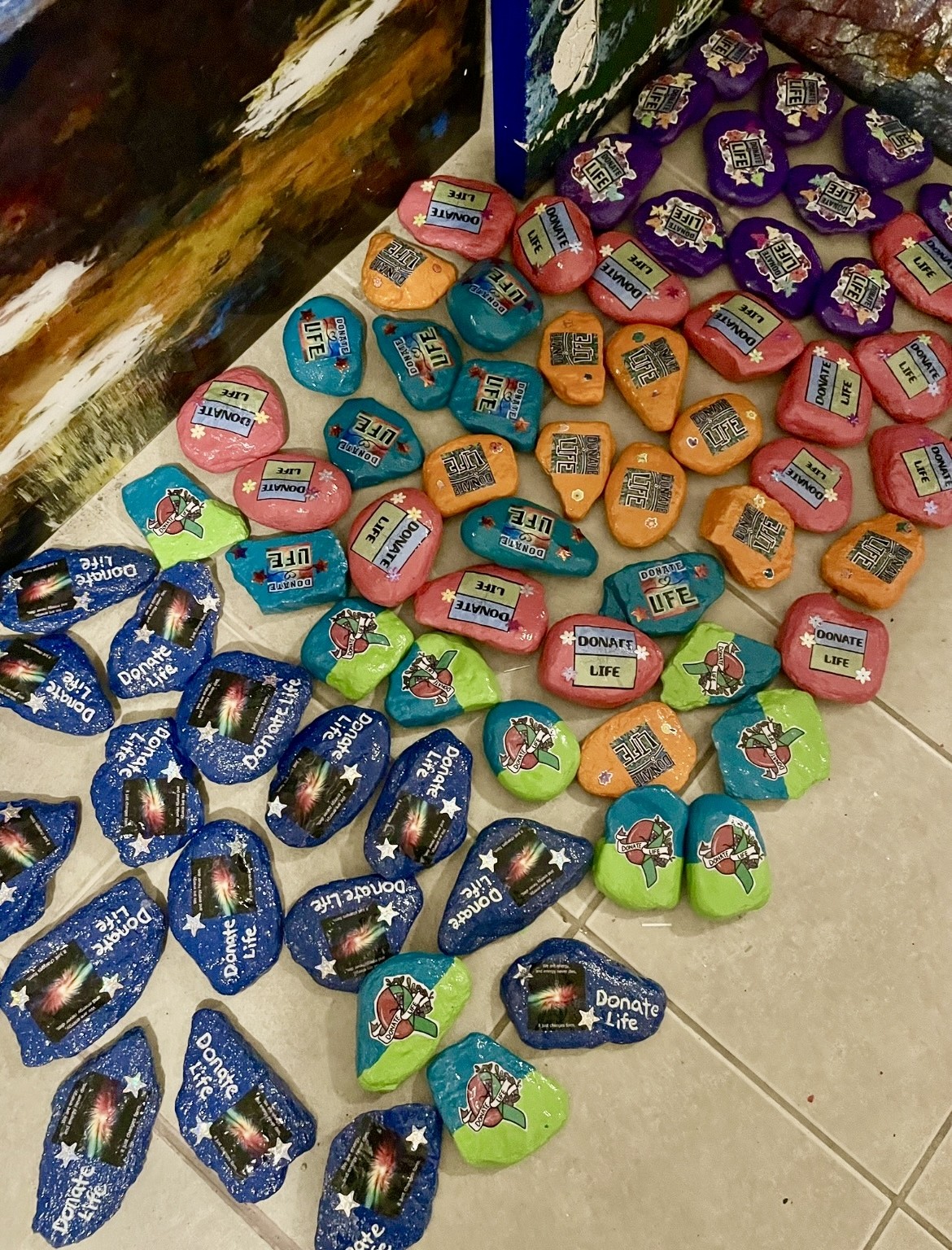 Colorful candies and chocolates arranged on a surface, with various packaging and shapes, including blue, pink, orange, and green wrappers.