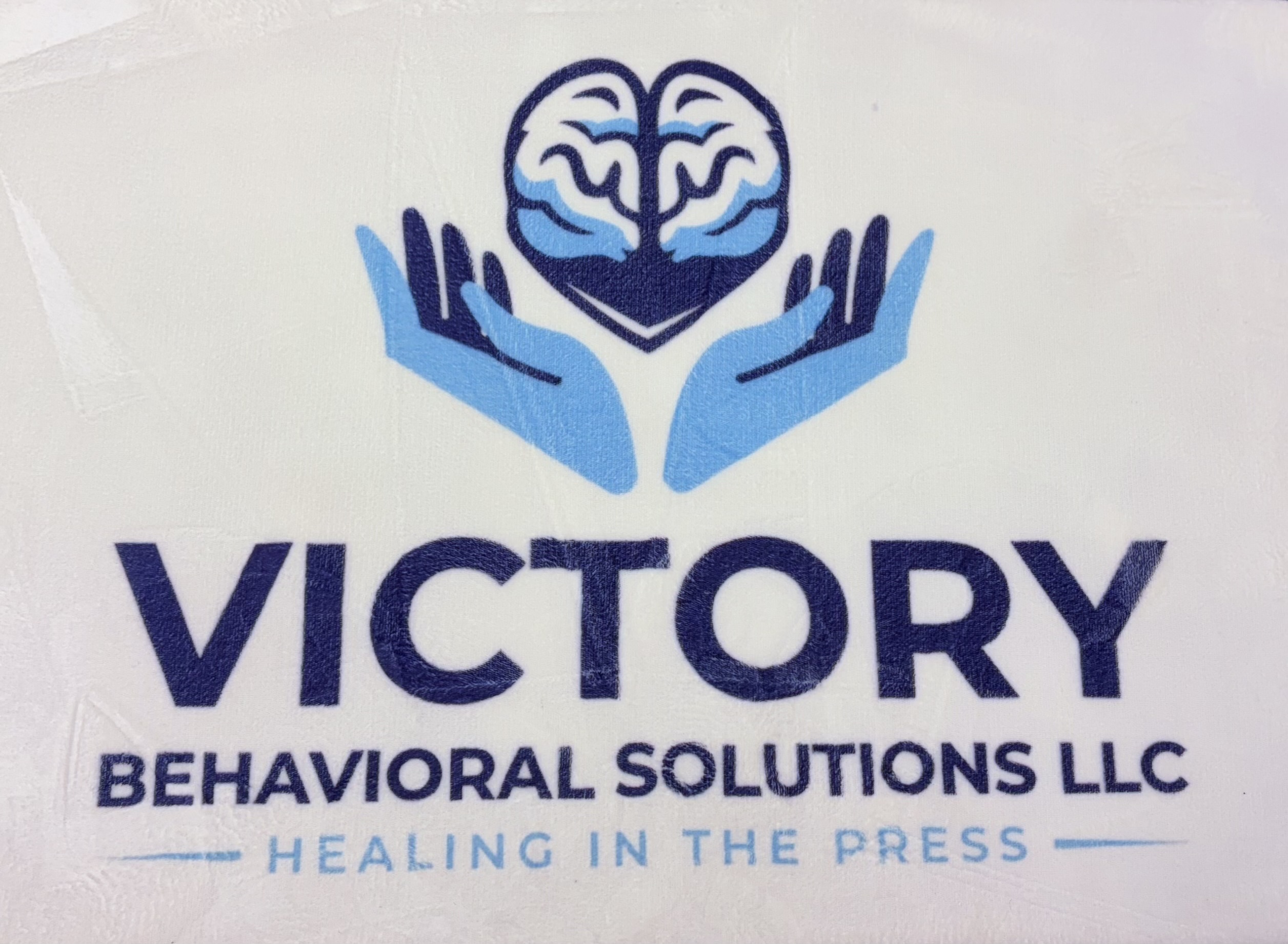Logo with a brain inside a heart, two hands below, and text 'VICTORY BEHAVIORAL SOLUTIONS LLC' and 'HEALING IN THE PRESS'.