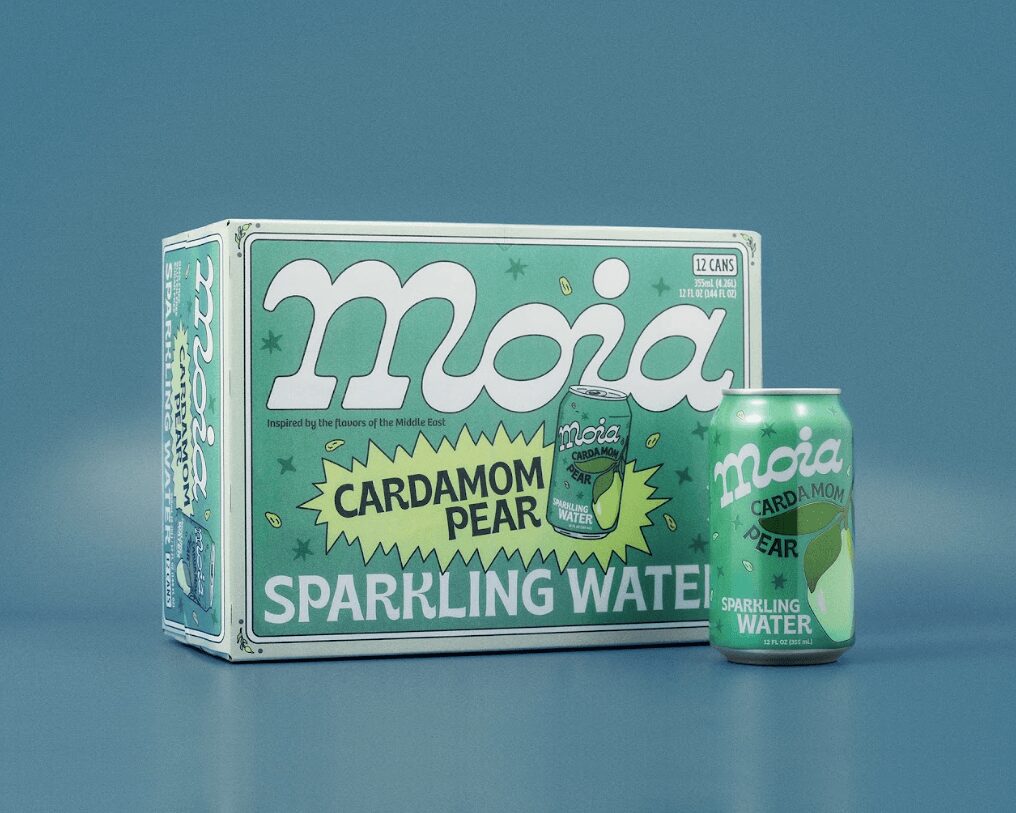 Box and can of Moia Cardamom Pear sparkling water on blue background, box shows a cartoon pear character, can has similar design.