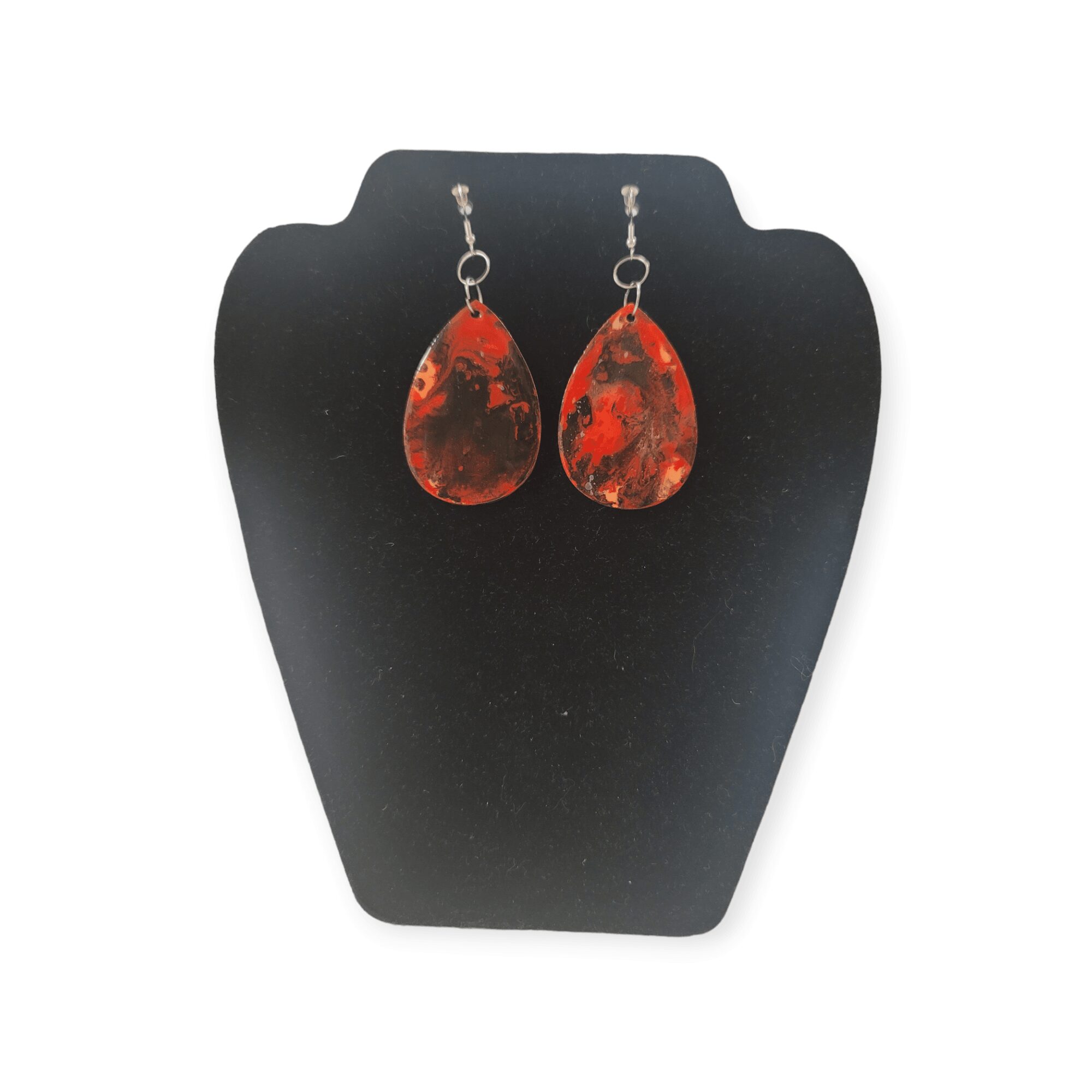 Red and black teardrop earrings on black display card, no background, simple presentation.