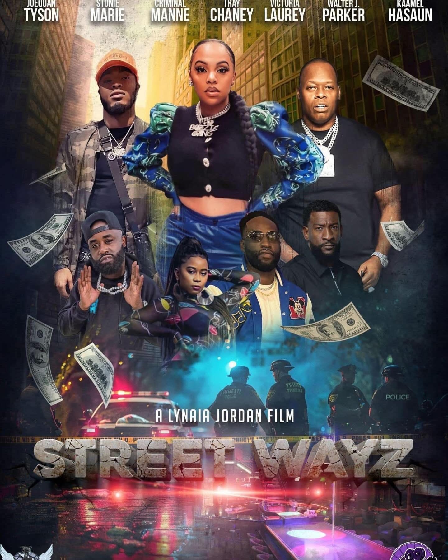 Group of seven people standing in front of a city street with dollar bills floating around, movie title at bottom.