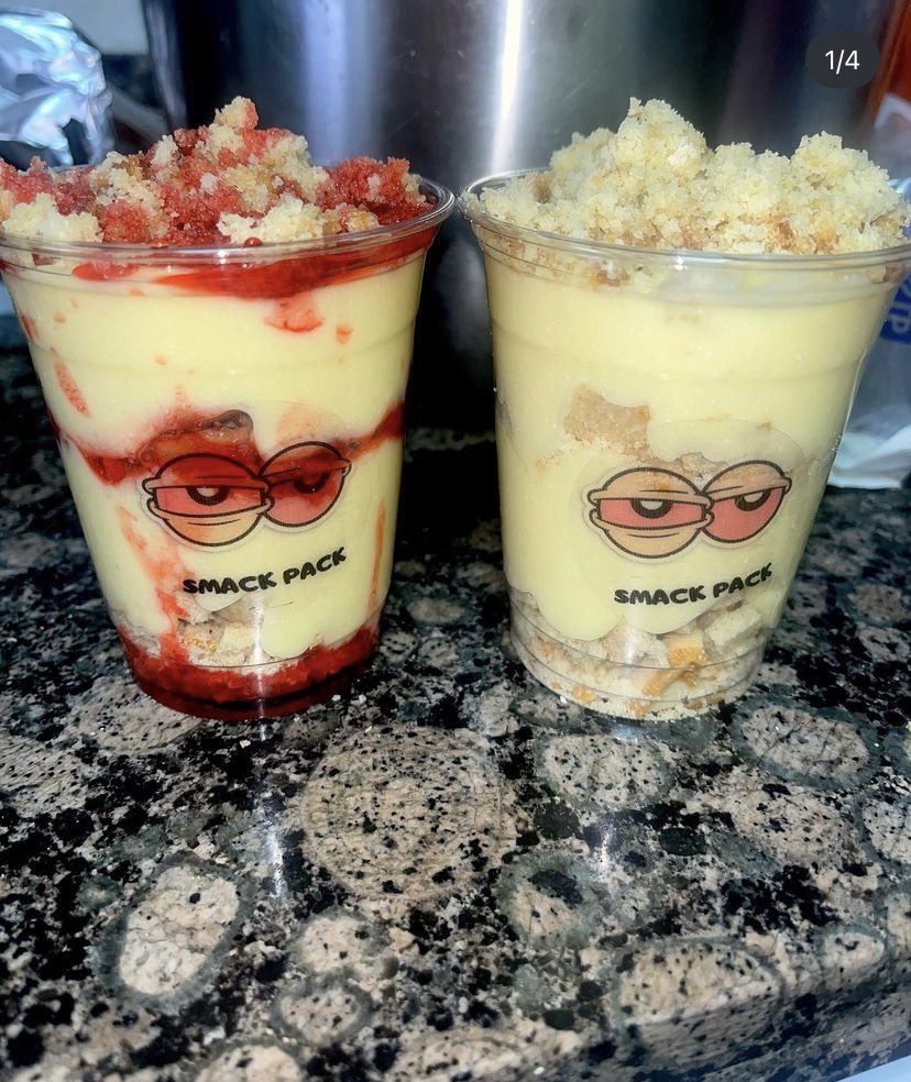 Two cups of dessert with crumb toppings and fruit syrup, featuring a logo with sunglasses and the text 'SMACK PACK'.