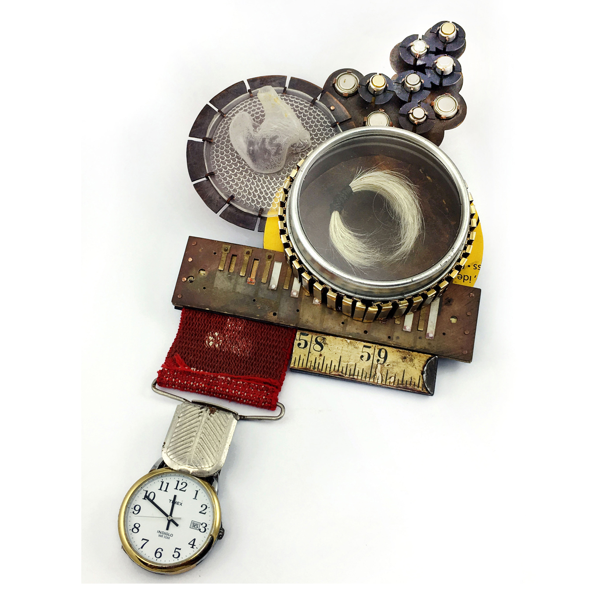 Collection of objects including a watch, ruler, metal container, and small bottles, arranged on a white background.