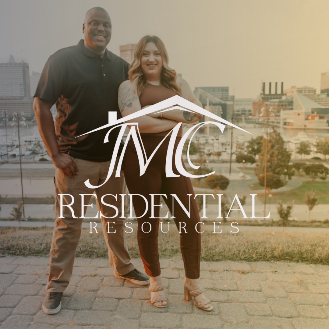 Two people standing outdoors on a city street with buildings in the background, smiling, with a logo overlay reading 'MC Residential Resources'.