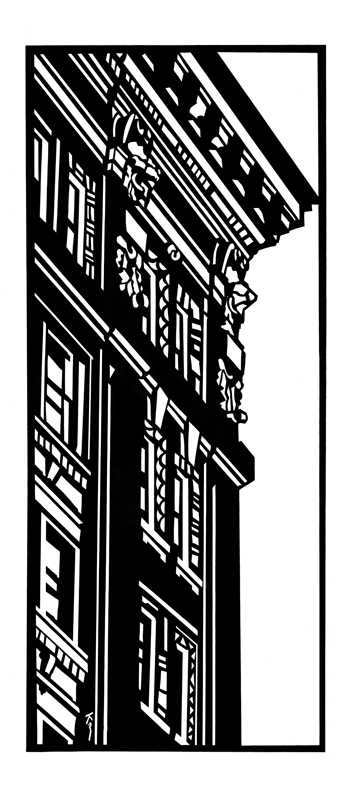 Upright view of a detailed building facade with ornate architectural elements.