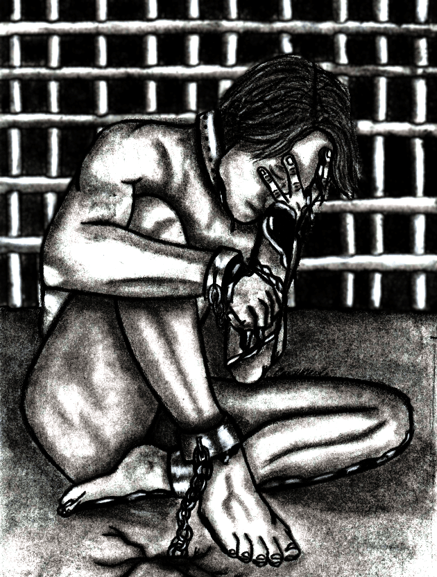 Person sitting on the ground with hands and feet chained, head bowed, in front of a barred background.