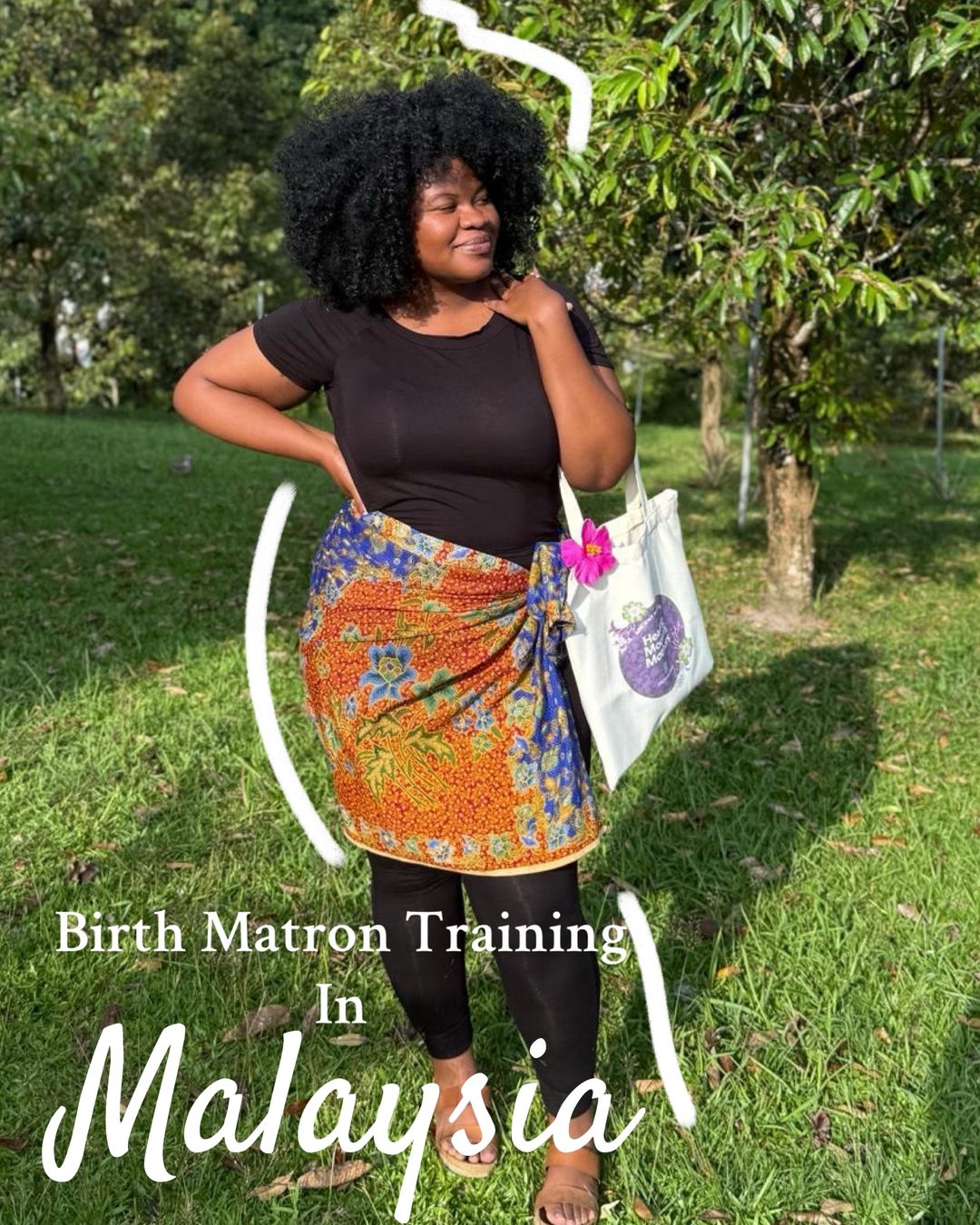 Woman with curly hair standing outdoors near trees, holding a bag, smiling, with text about Malaysia training.