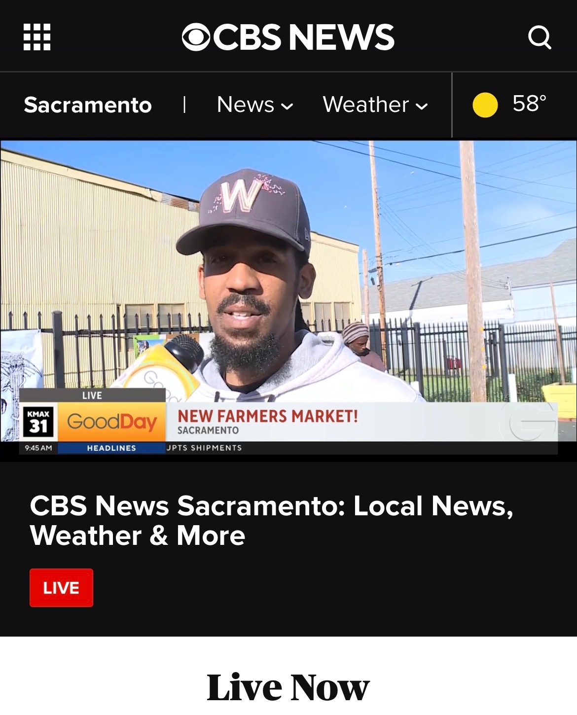 Man wearing a baseball cap with a 'W' logo being interviewed outdoors, with a fence and utility poles in background.
