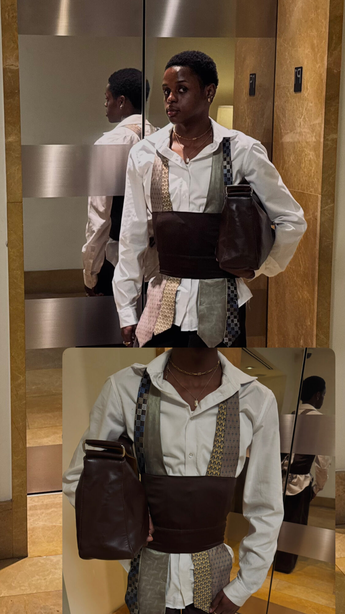 Person with short hair in a white shirt holding a large bag, standing in front of a mirror and elevator door.